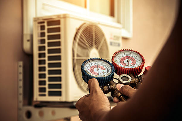 Professional Air Conditioning Service technician working in Chester, NH